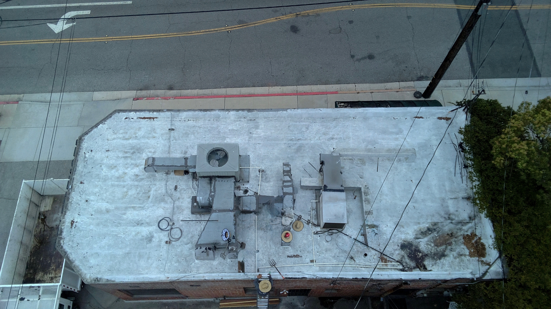 Commercial flat roof before Dena Roofing Pros restoration